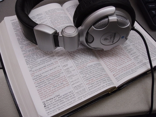 Headphones on a Bible to illustrate communion with God