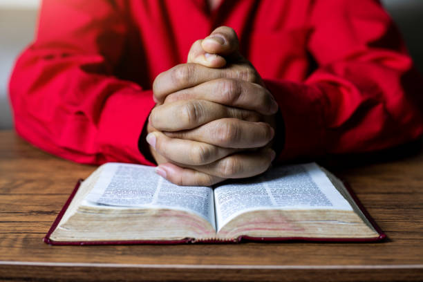 A man reading the Holy Bible reverently