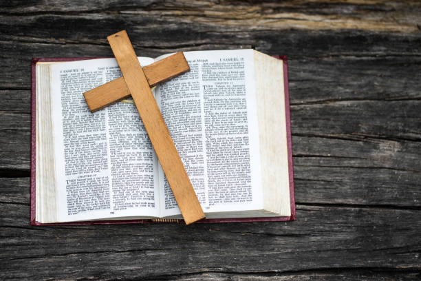 An open Bible with a cross on it