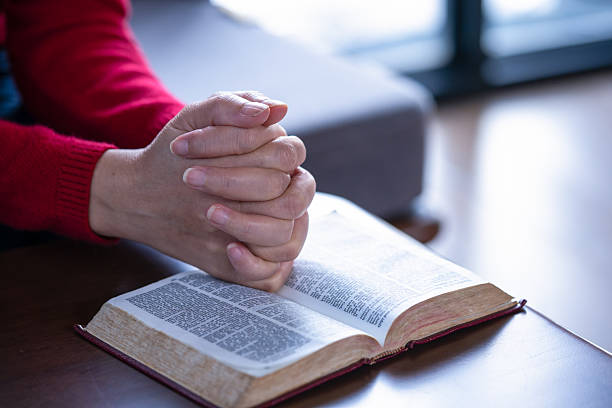 A woman reading a Bible