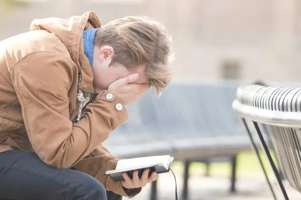 A man meditating on the Bible